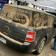 Illustration for article titled Sand Artist Scott Wade Makes Art Out Of Ford Flex